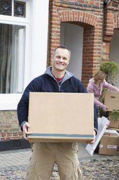 Professional removalists assisting with moving household items