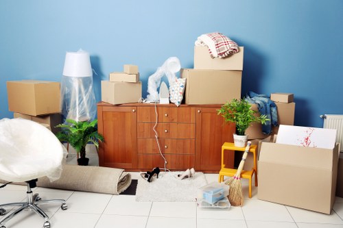 Workers handling furniture for storage pick-up