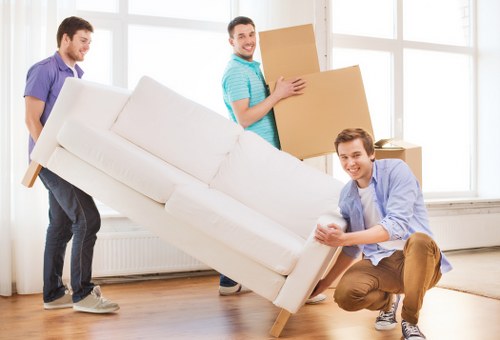 Experts carefully packing fragile items in storage