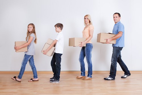 Man with Van loading items into a storage unit